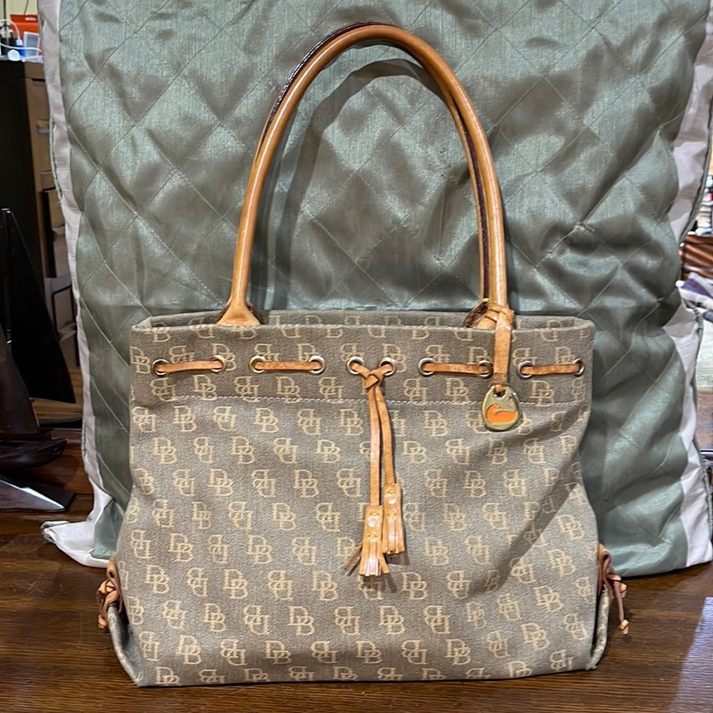 Like new! Dooney and Burke shoulder bag with leather handles and detailing.